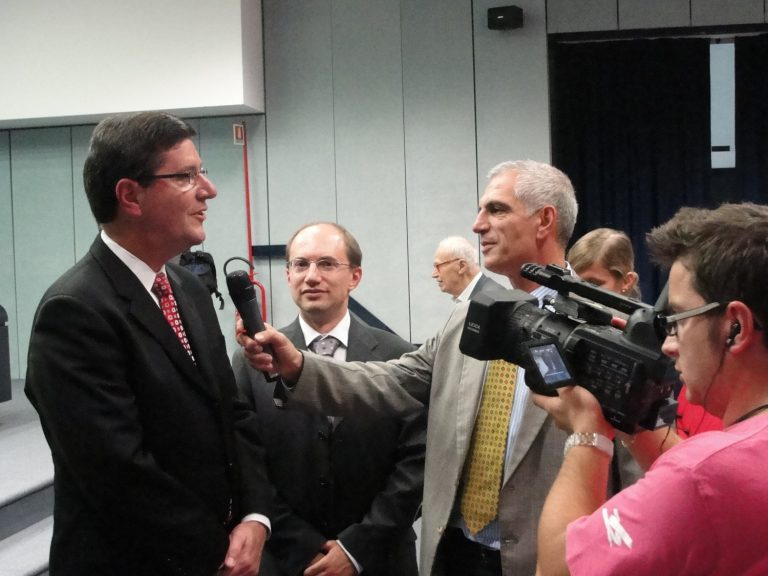 Jere Palazzolo being interviewed by press at collaboration ceremony in San Giovanni Rotondo, Italy